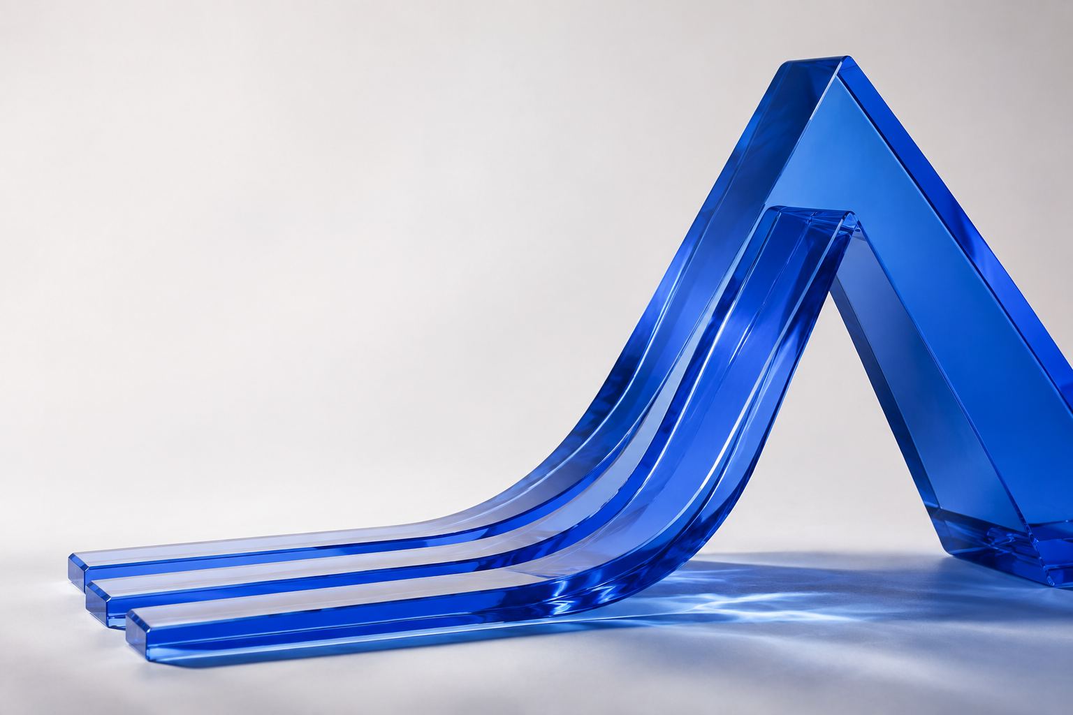 Cobalt glass waves rise into an angular arch